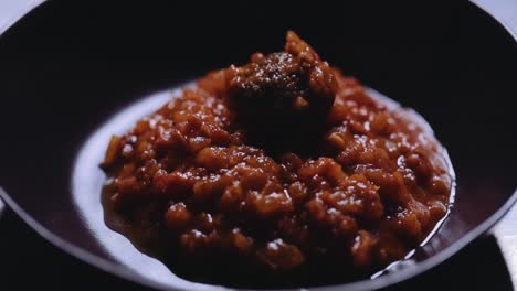 serving meatballs on a plate with red tomato sauce