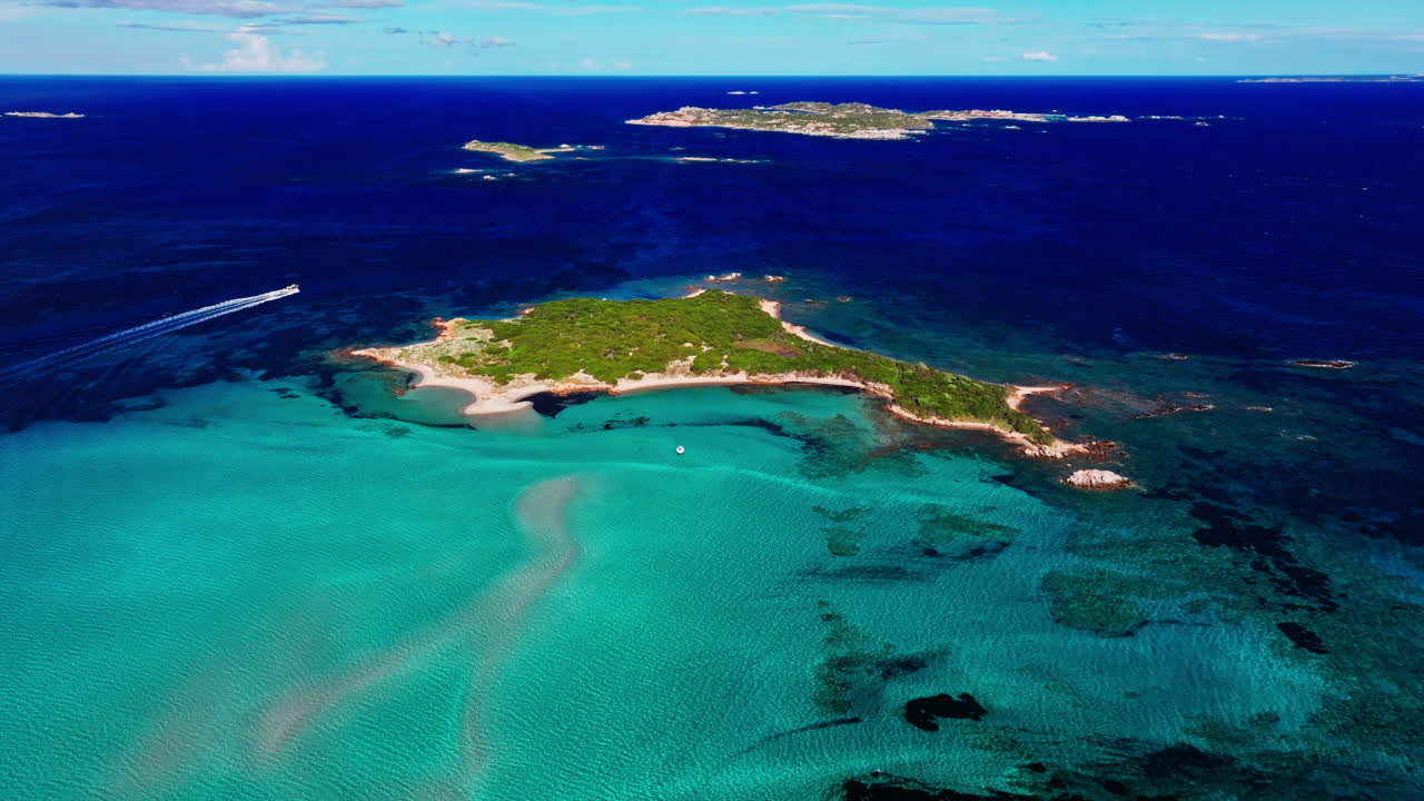 Aerial drone view of beautiful coastline of Corsica, France. High view of the colorful turquoise sea and the picturesque green landscape. Bird's eye view of the beaches. Summer holidays destination