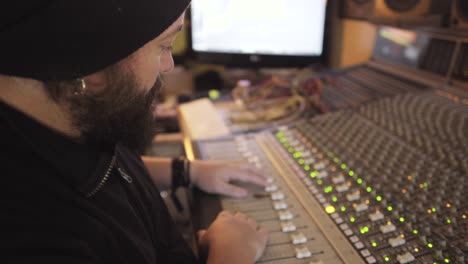 man in a equalizer instrument in a studio