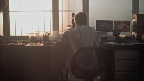 scientist working in a paleontology laboratory