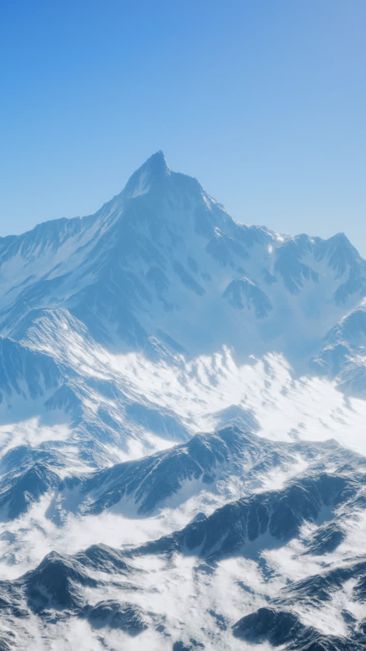 Majestic mountain peaks rise above a vast expanse of snow and ice