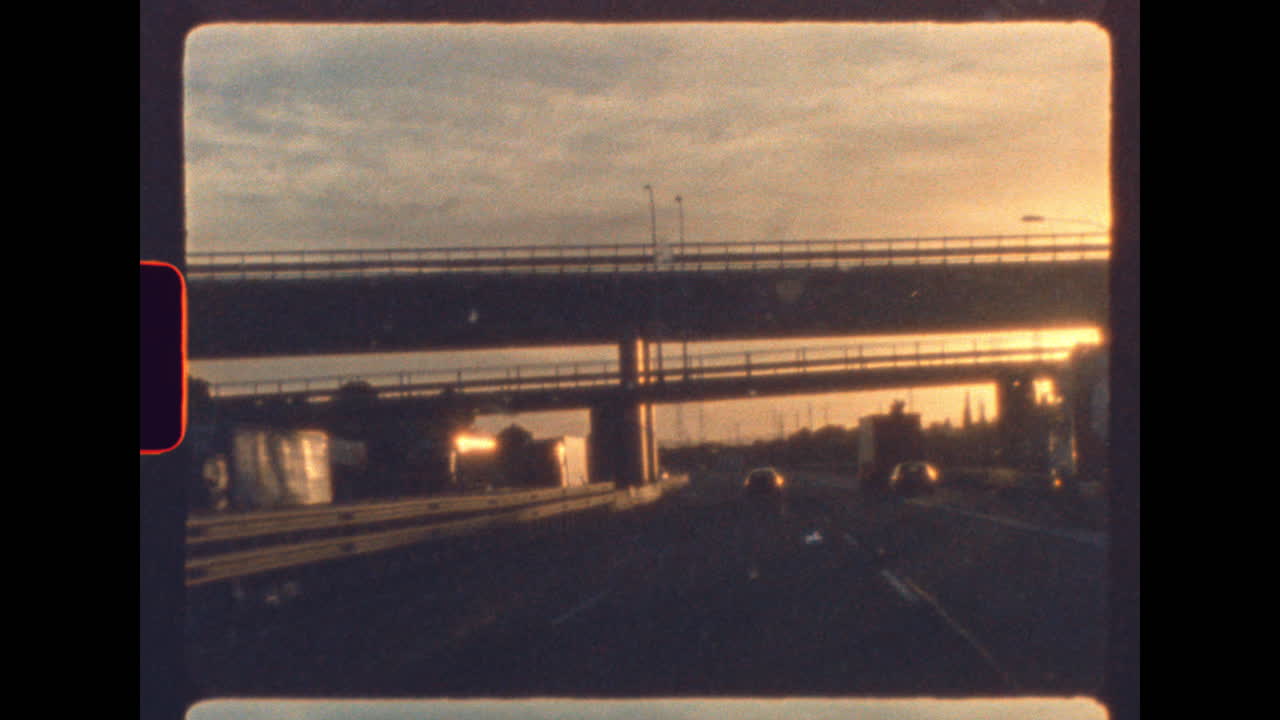 Vintage sunset drive under highway overpass captured on real 8mm film