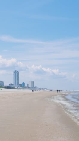 beach scene with buildings and people