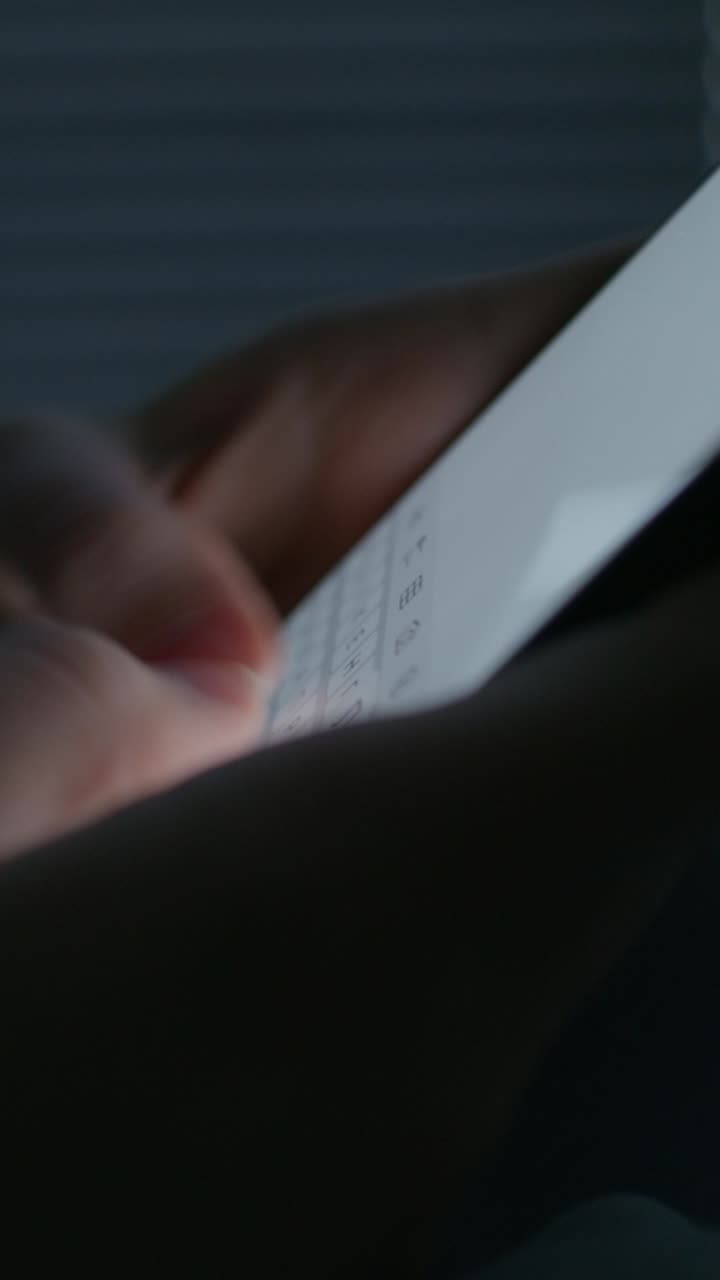 Person using a smartphone at night