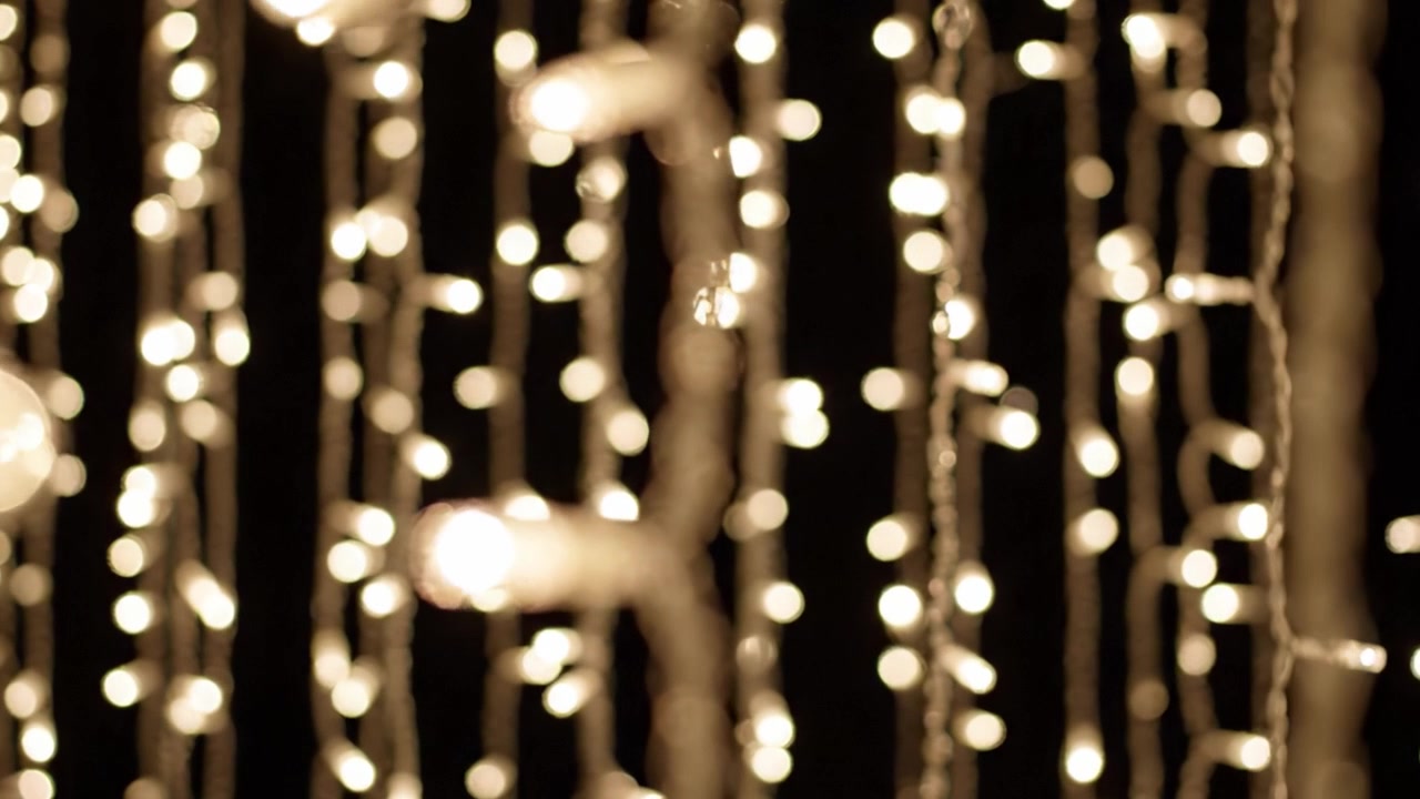 A Dreamy Display of Twinkling Lights: Captivating Bokeh Effect and Enchanting Glow in a Stylish Setting Enhancing the Ambiance for Any Occasion