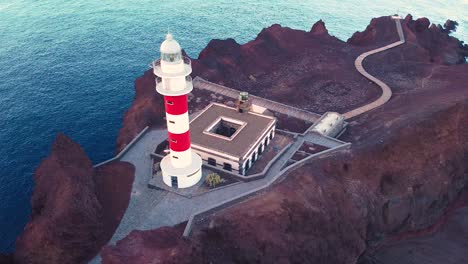 drone backward pan and spin view of lighthouse at la punta de teno in tenerife