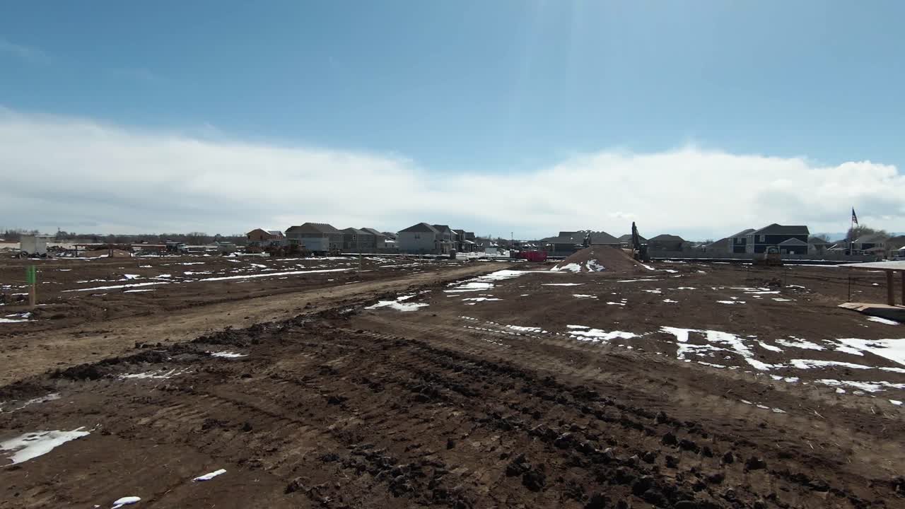 Aerial view of large construction area near the city.