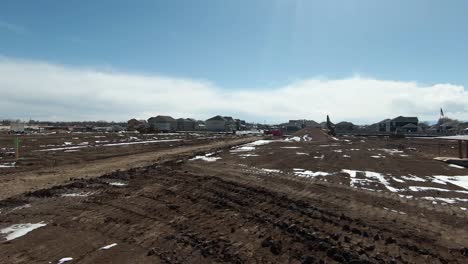 aerial view of large construction area near the city.