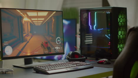 rgb powerful computer with first-person shooter game on screen