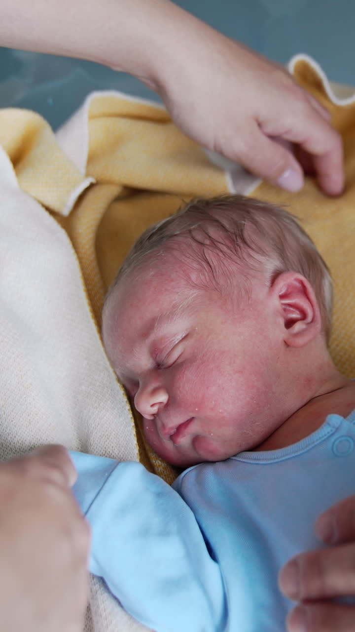 Small newborn baby portrait. Parenthood little boy concept. Vertical video