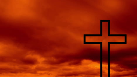 cross silhouette against dramatic orange and red cloudy sky at sunset