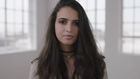 portrait of beautiful young teenage girl looking serious intense at camera cute brunette woman feminine beauty