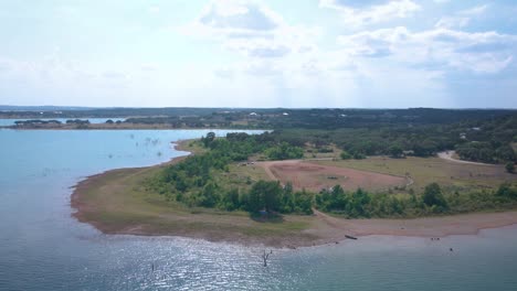 Aerial-shots-of-a-lake-park-in-Texas-on-the-popular-Canyon-Lake-while-barely-any-boats-are-cruising-around