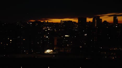 new york city skyline sunset over buildings, day to night, time lapse
