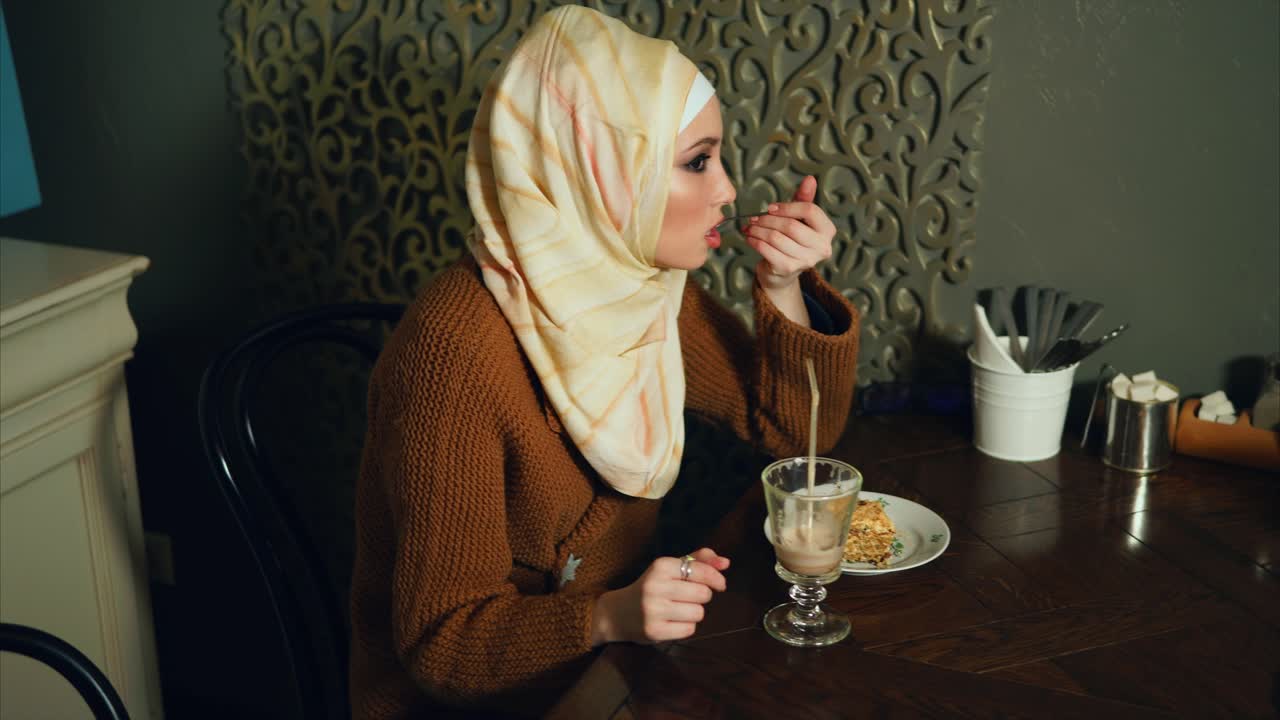 Woman eating dessert in a cafe
