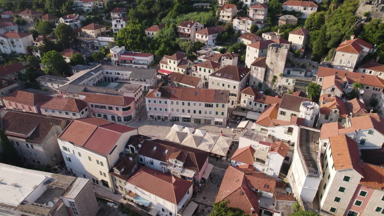 Aerial: Nikola Djurkovic Square's timeless charm in sunlit Herceg Novi, Montenegro