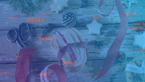 Animation-of-holly-text-in-orange-on-blue,-over-christmas-decorations