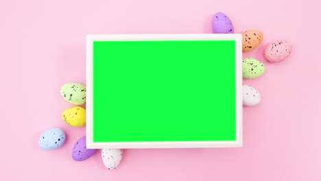 frame with green screen for easter with colored eggs. stop motion