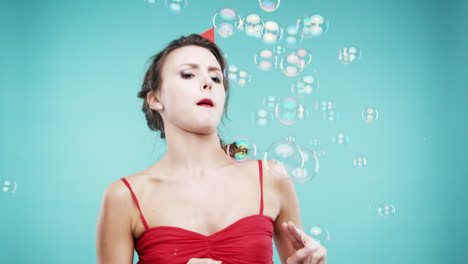 crazy face woman shooting bubble shower slow motion photo booth blue background