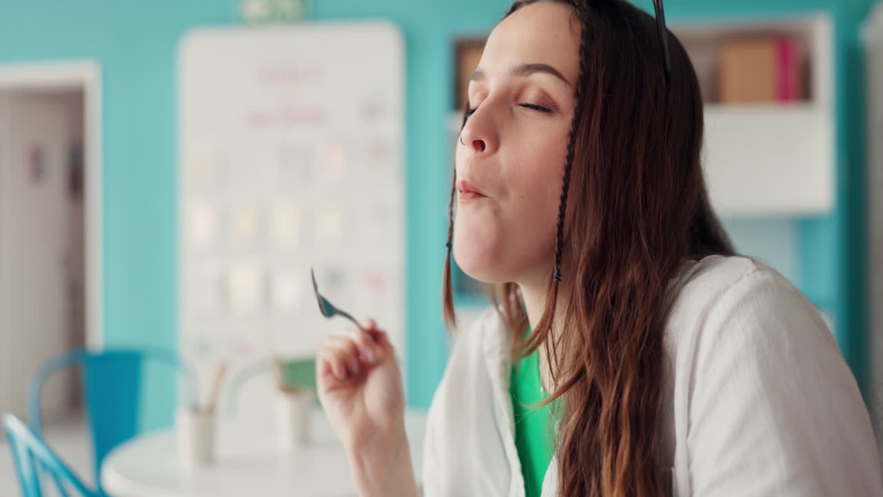 Cake, store and happy woman eating at a cafe