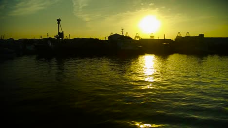 Passing-the-harbor-Silhouette-view-with-sunset