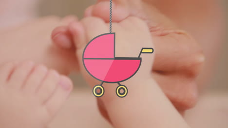 animation of hanging baby stroller over caucasian baby playing