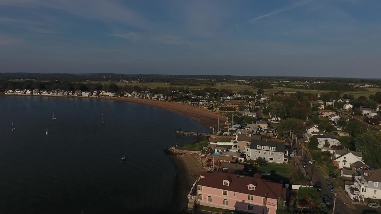fly over of town by the shore