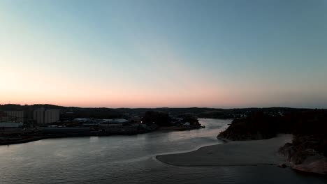 The-river-Logen-pouring-into-the-ocean-in-Larvik-Norway-during-a-beautiful-sunset