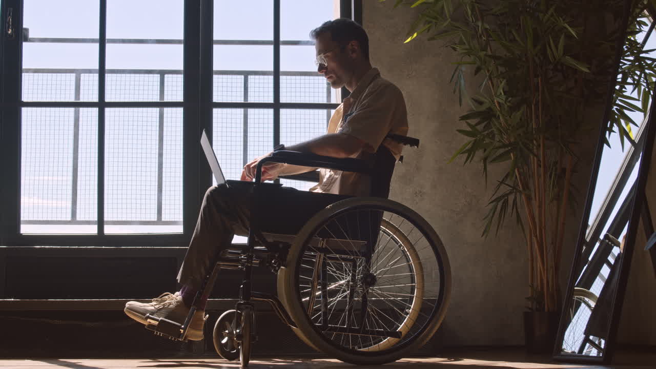 Wheelchaired Man by Window