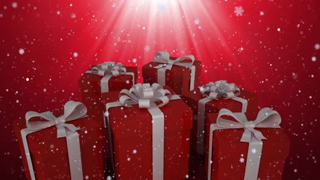 animation of christmas presents and snow falling in winter scenery