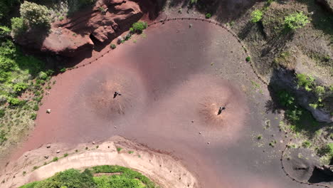 couple with dog enjoy sunny day in volcanic area surrounded by pristine nature