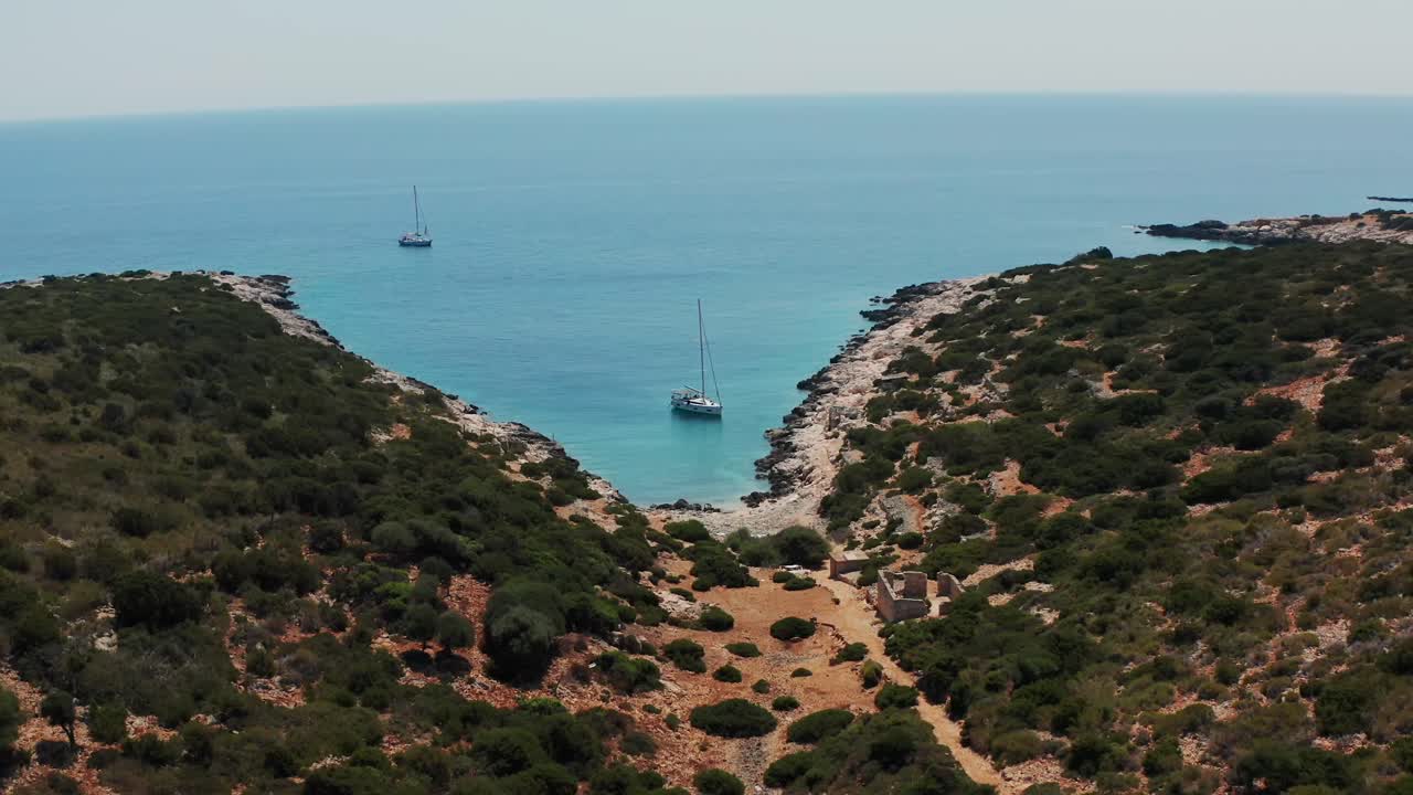 Aerial View of Secluded Cove with Sailboats