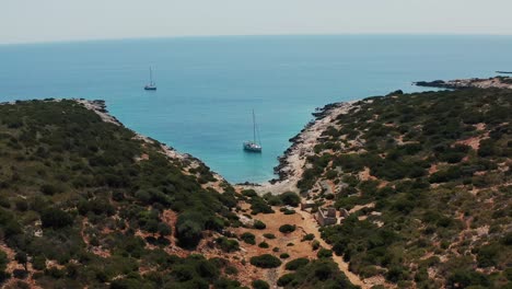 aerial view of secluded cove with sailboats