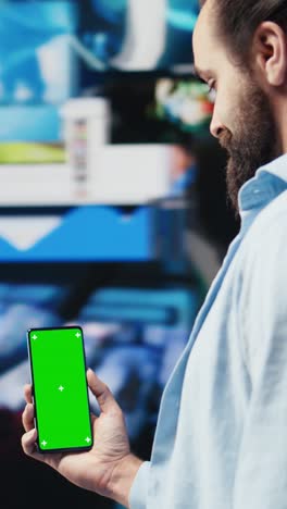 vertical video male web user navigates phone with copy space for social media platforms