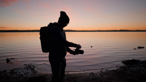 photographer at sunset on the lake