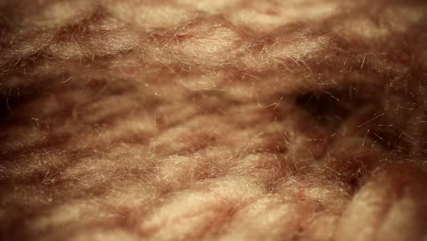 Pulling out a handmade pink sock, short segment where the top and bottom look mirrored