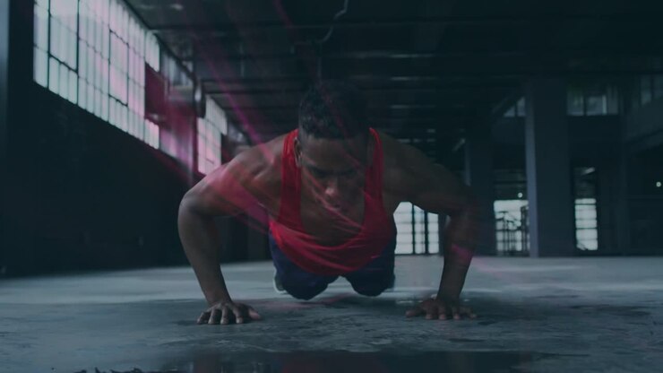 Man lowering chest to puddle doing pushup lifting for fitness pink streaks in puddle cam shifting