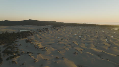 aerial view of sand dunes at sunset