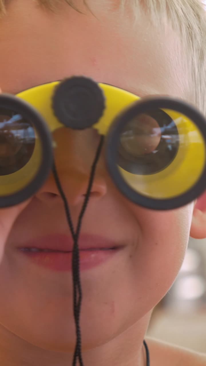 Child with Yellow Binoculars