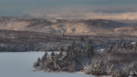 monson lake woodland landscape covered in winter snowfall