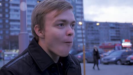 young man eating a sandwich