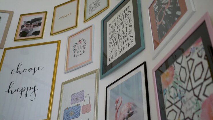Decorative Art And Quote Frames Hanging On The Wall By The Curved Stairway In A Vegan Restaurant In Dubai, UAE - Modern Interior Concept - tilt-up panning shot