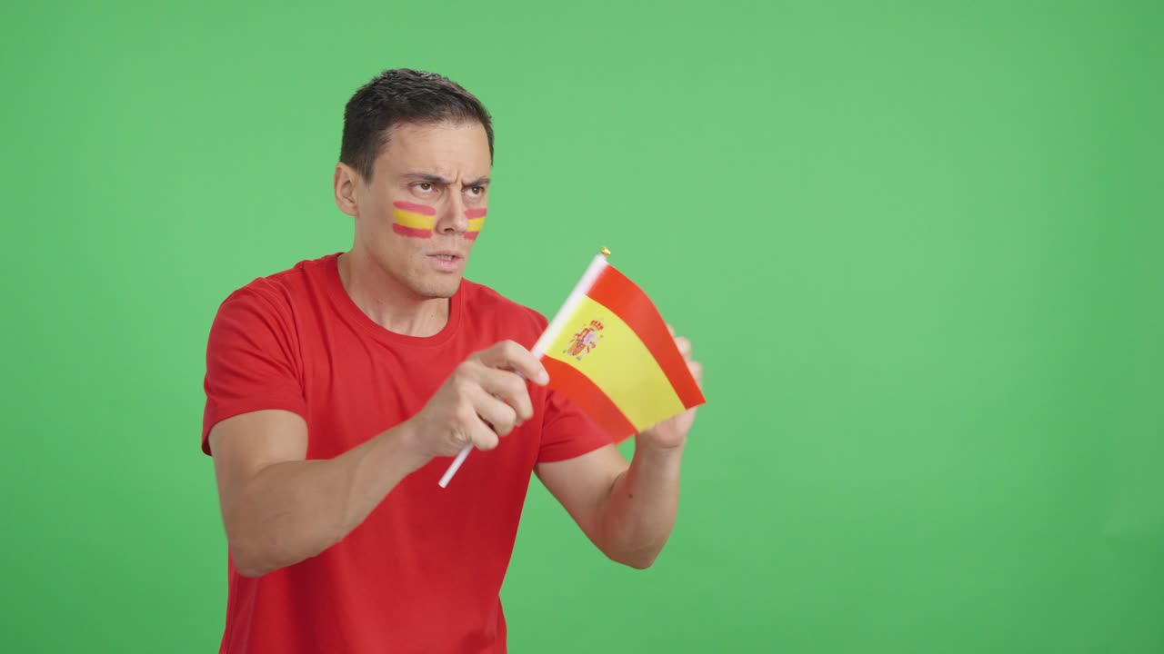 Nervous spanish supporter during an exciting match looking away