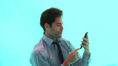 Man-using-smartphone-underwater