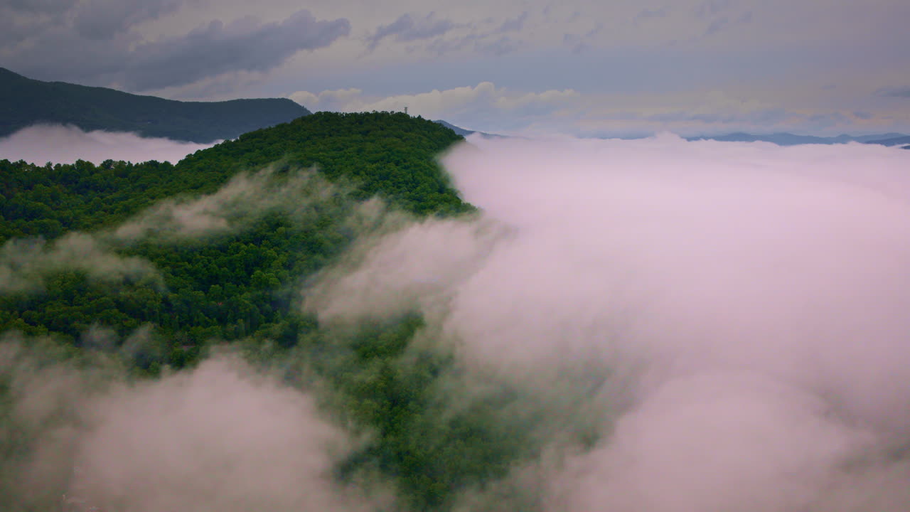 A sea of mist flows through the Smoky Mountains in cinematic form