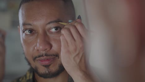 man getting his eyebrows done