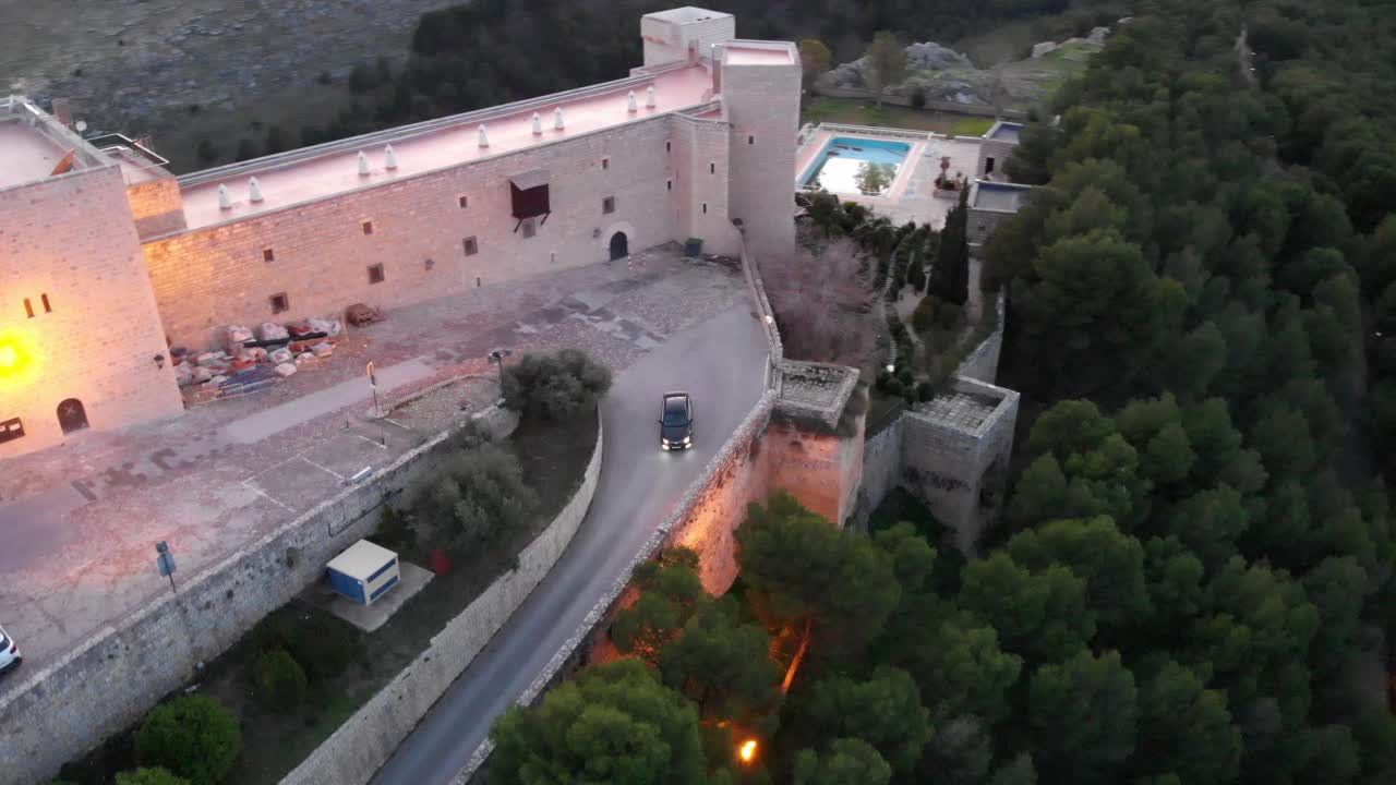 Jaen's Castle Saint Catalina Castle Spain shoot with a drone at 4k 24fps showing the exterior and the city from multiple points on a afternoon in December.