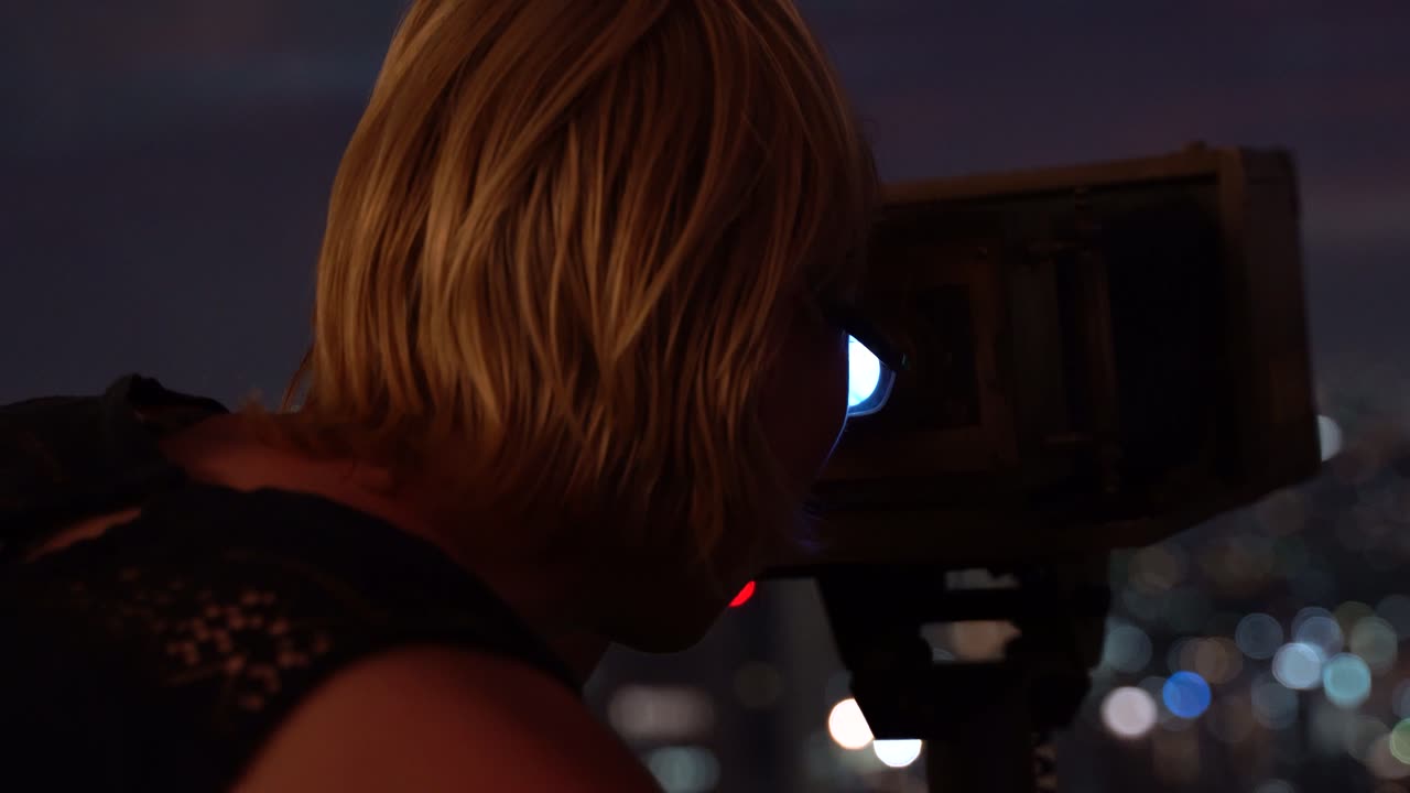 Joyous lady tourist excited seeing Barcelona with binoculars