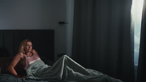 woman waking up in bed