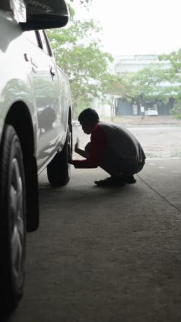 Man repairing a car tire